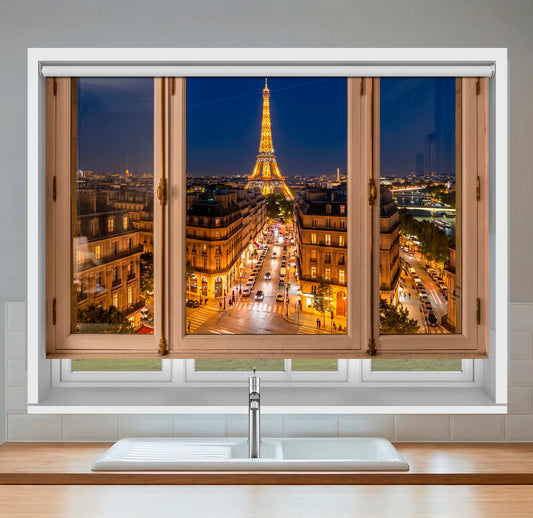 Close-up of Art Fever faux window roller blind showing a realistic nighttime view of the illuminated Eiffel Tower and Paris streets through a wooden window frame.