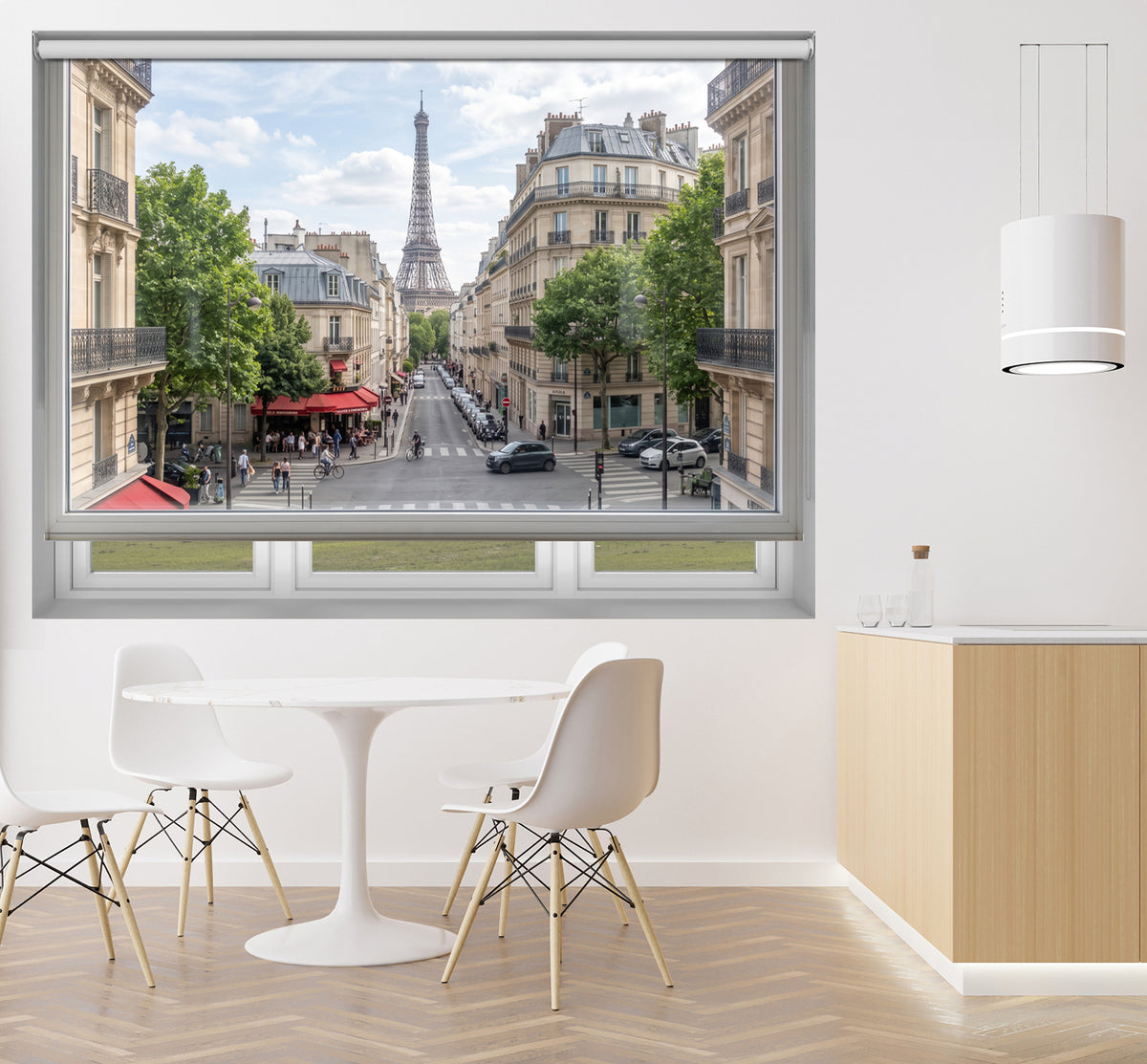 Art Fever Paris cityscape faux window roller blind styled in a bright, modern dining area with a minimalist white table and chairs.