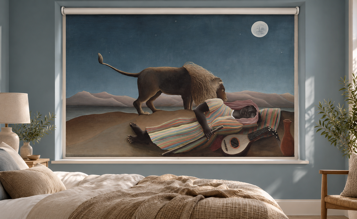 Printed roller blind featuring Henri Rousseau's famous fine art painting 'The Sleeping Gypsy', showing a figure in a striped dress asleep on the ground with a mandolin and a lion sniffing them under a full moon and starry night sky