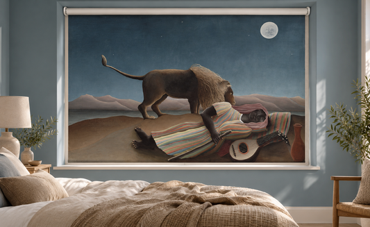 Printed roller blind featuring Henri Rousseau's famous fine art painting 'The Sleeping Gypsy', showing a figure in a striped dress asleep on the ground with a mandolin and a lion sniffing them under a full moon and starry night sky