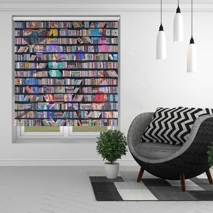 Printed roller blind featuring a dense pattern of vibrantly coloured books stacked on dark shelves, hanging in a modern living room setting